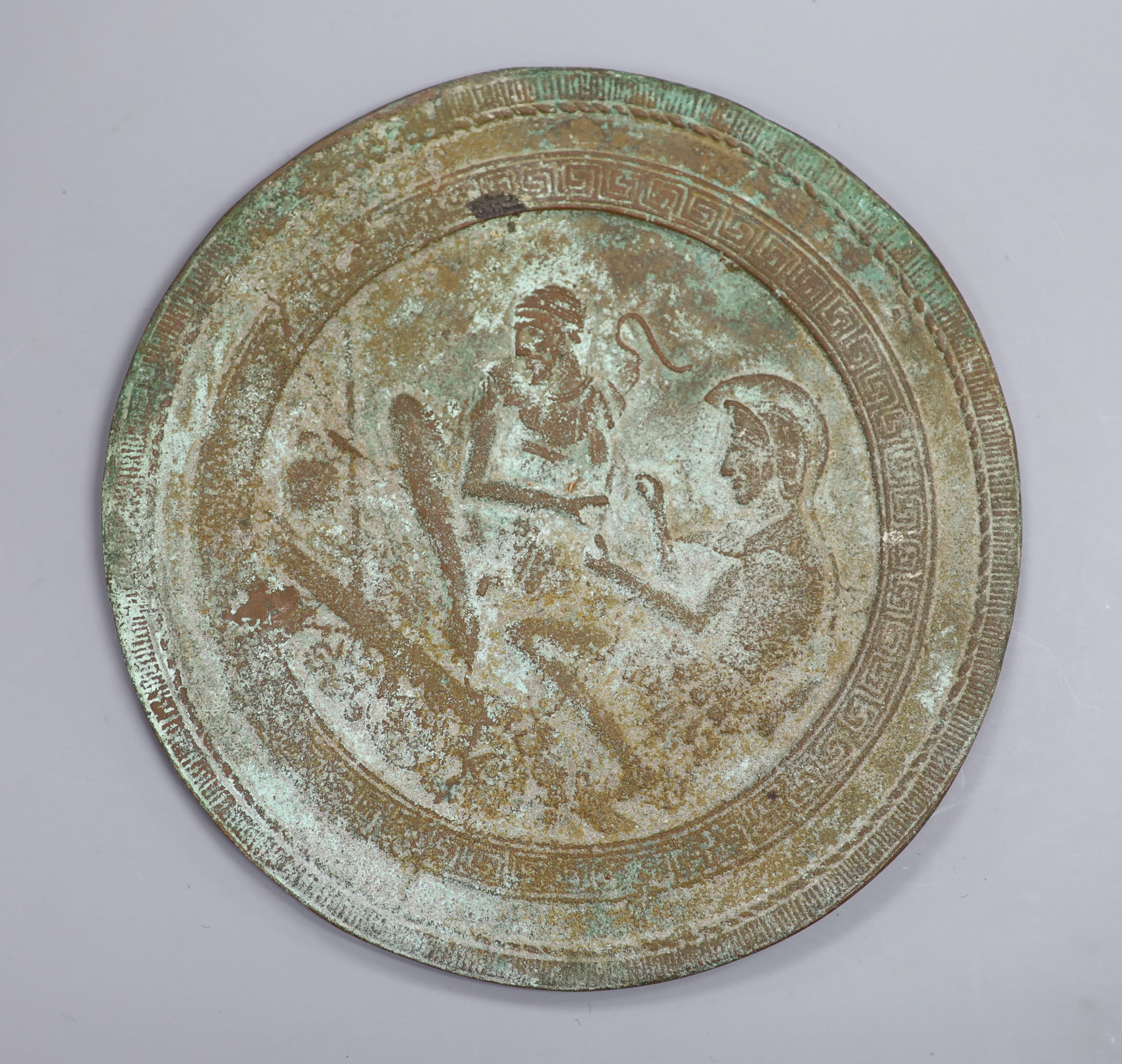 A Greek or Egyptian cast bronze roundel, diameter 18cm